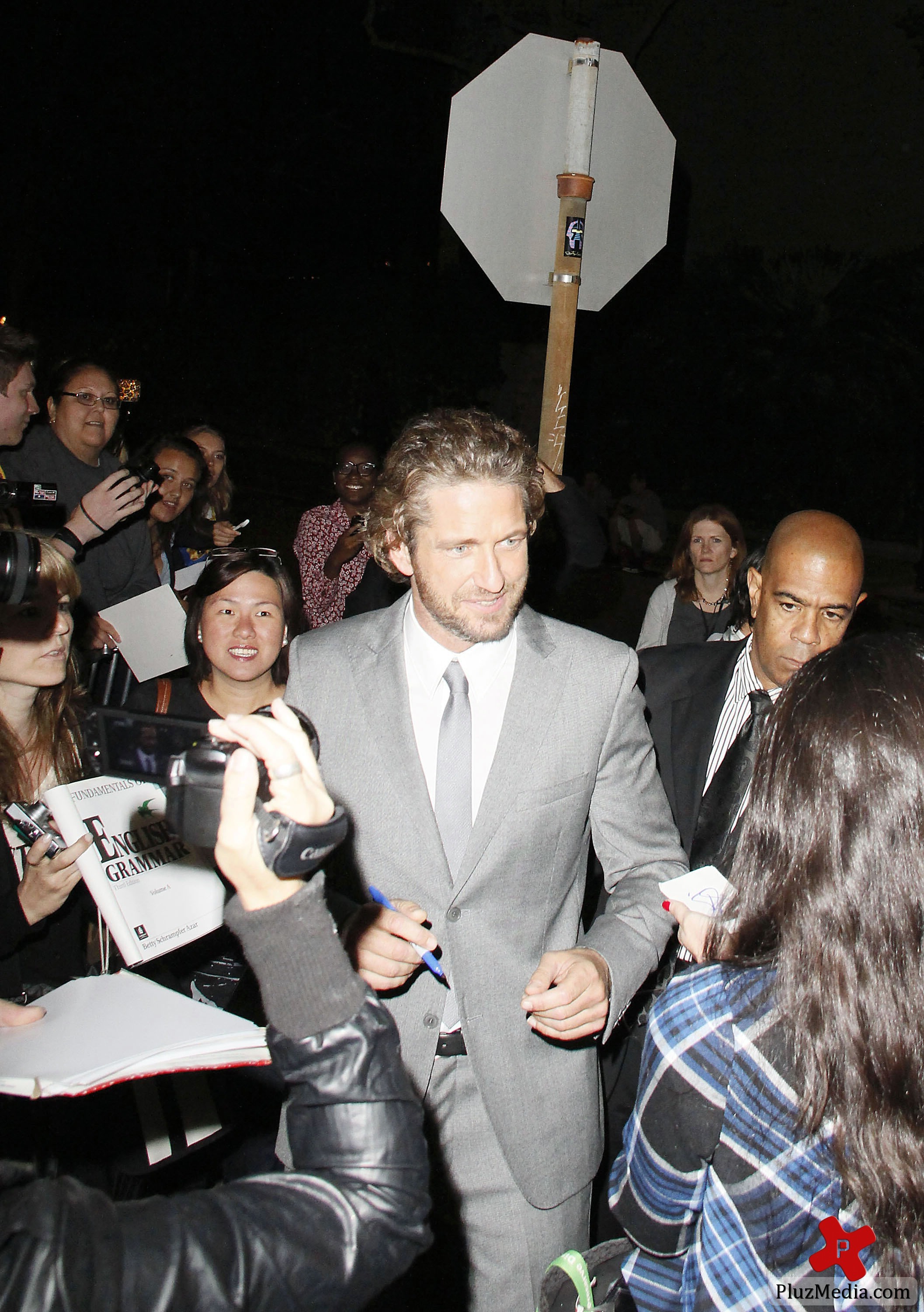 Gerard Butler signs autographs for fans at the 'Machine Gun Preacher' premiere | Picture 84223